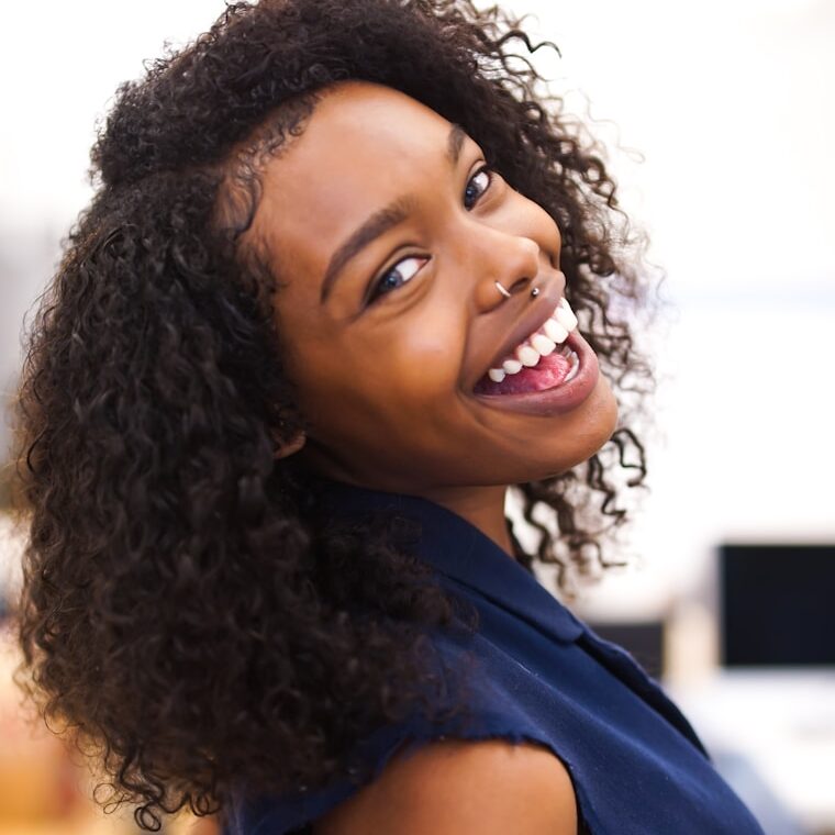 woman looking back while smiling